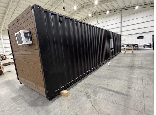 Container duplex shell, steel outside and finished siding